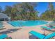 A view of the community swimming pool and deck area surrounded by mature trees at 2109 Rowan Rd, Johns Island, SC 29455