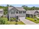 Charming two-story home featuring a two-car garage, well-maintained lawn, and attractive landscaping at 2109 Rowan Rd, Johns Island, SC 29455