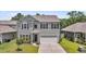 Charming two-story home featuring a two-car garage, well-maintained lawn, and attractive landscaping at 2109 Rowan Rd, Johns Island, SC 29455