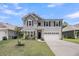 Charming two-story home featuring a two-car garage, well-maintained lawn, and attractive landscaping at 2109 Rowan Rd, Johns Island, SC 29455
