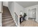 Inviting hallway showcasing stairs to the second floor and entry to another room at 2109 Rowan Rd, Johns Island, SC 29455