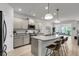 Kitchen with island and bar seating, pendant lights and stainless steel appliances at 2109 Rowan Rd, Johns Island, SC 29455