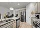 Kitchen island with sink, stainless steel appliances, and neutral colored cabinetry at 2109 Rowan Rd, Johns Island, SC 29455