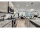 Well-equipped kitchen with stainless steel appliances and granite countertops opens to the living spaces at 2109 Rowan Rd, Johns Island, SC 29455