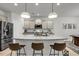 Kitchen with granite island, pendant lighting, stainless steel refrigerator at 2109 Rowan Rd, Johns Island, SC 29455