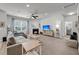 Spacious living room featuring a fireplace, large window, neutral decor, and comfortable seating at 2109 Rowan Rd, Johns Island, SC 29455