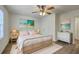 Airy bedroom featuring natural light, ceiling fan, stylish décor, and a cozy woven bed frame at 2150 Spoleto Ln # H2, North Charleston, SC 29406