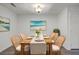 Cozy dining room with wood table, wicker chairs and neutral colors creating an inviting atmosphere at 2150 Spoleto Ln # H2, North Charleston, SC 29406