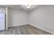 Empty room with gray floors, a refrigerator and minimalist design creating a blank canvas at 2150 Spoleto Ln # H2, North Charleston, SC 29406