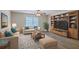 Inviting living room features stylish furniture, area rug, and a built-in entertainment center with bookshelves at 2150 Spoleto Ln # H2, North Charleston, SC 29406