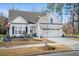 Charming single-Gathering home with a manicured front yard, attached two-car garage and white picket fence at 218 River Martin Ct, Summerville, SC 29483