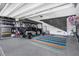 Spacious garage equipped with golf cart, work bench, epoxy flooring and storage at 218 River Martin Ct, Summerville, SC 29483