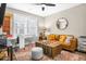 Cozy living room features a comfortable couch, area rug, and natural light from large window at 218 River Martin Ct, Summerville, SC 29483