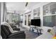 Relaxing screened porch with comfortable seating and serene views, perfect for outdoor entertaining at 218 River Martin Ct, Summerville, SC 29483