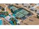 Aerial view of tennis and pickleball courts near a community center with a pool and lounge area at 218 River Martin Ct, Summerville, SC 29483