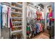 Organized walk-in closet with shelving and hanging racks at 218 River Martin Ct, Summerville, SC 29483