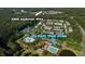 An aerial view of Park West featuring pools, tennis courts, ponds and many homes surrounded by lush greenery at 2204 Andover Way, Mount Pleasant, SC 29466