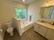 Bathroom featuring a soaking tub, toilet and a vanity with countertop and sink at 2204 Andover Way, Mount Pleasant, SC 29466