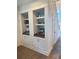 Stylish coffee bar area with blue tile backsplash and built-in shelves and cabinets at 2204 Andover Way, Mount Pleasant, SC 29466