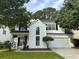 Charming two-story home featuring black shutters, a manicured lawn, and an attached two car garage at 2204 Andover Way, Mount Pleasant, SC 29466