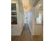 Hallway with custom built-ins, hardwood floors, and a view into other rooms at 2204 Andover Way, Mount Pleasant, SC 29466