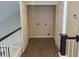 Upstairs laundry closet area includes washer and dryer hookups and wood floors at 2204 Andover Way, Mount Pleasant, SC 29466