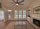 Comfortable living room with a fireplace, built-in shelves, and large windows for natural light at 2204 Andover Way, Mount Pleasant, SC 29466