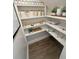 Pantry with built-in shelving, wood floors, and ample storage space at 2204 Andover Way, Mount Pleasant, SC 29466
