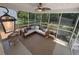 Relaxing screened porch with fan, seating, and view of the backyard at 2204 Andover Way, Mount Pleasant, SC 29466