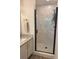 Modern bathroom shower with glass door and stone tile at 2204 Andover Way, Mount Pleasant, SC 29466