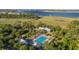 Breathtaking aerial view highlights the pool, surrounding nature, and waterfront at 2431 Settlers St, Charleston, SC 29492