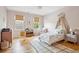 Charming bedroom with hardwood floors, canopy bed, and large windows at 2431 Settlers St, Charleston, SC 29492