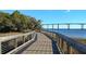 Scenic boardwalk with a wooden deck and a bridge in the background at 2431 Settlers St, Charleston, SC 29492