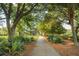 Picturesque community walking path surrounded by lush greenery and mature trees at 2431 Settlers St, Charleston, SC 29492