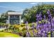 A well-manicured community entrance sign surrounded by colorful flowerbeds welcomes residents and guests at 2431 Settlers St, Charleston, SC 29492