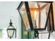 Close-up of a gas-powered outdoor lamp on the front porch with a flame burning at 2431 Settlers St, Charleston, SC 29492