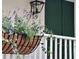 Charming flowers in a hanging basket decorate the cozy front porch at 2431 Settlers St, Charleston, SC 29492