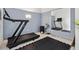 Functional home gym with modern equipment, including a treadmill and padded flooring for comfortable workouts at 2431 Settlers St, Charleston, SC 29492