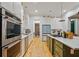 Well-appointed kitchen featuring modern appliances, a center island, and ample counter space at 2431 Settlers St, Charleston, SC 29492