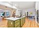 Gourmet kitchen boasts a large island with countertop seating and premium stainless appliances at 2431 Settlers St, Charleston, SC 29492