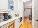 Kitchenette featuring a built-in microwave, drink refrigerator, and view to the next room at 2431 Settlers St, Charleston, SC 29492