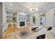 Bright living room with a fireplace, large windows, and comfortable seating, perfect for relaxation at 2431 Settlers St, Charleston, SC 29492