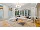 Bright, open living room featuring large windows, comfortable sectional sofa, and stylish decor at 2431 Settlers St, Charleston, SC 29492