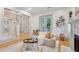 Bright living room features a fireplace, access to the patio, and open staircase at 2431 Settlers St, Charleston, SC 29492
