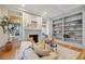 Elegant living room featuring a fireplace, built-in shelves, and natural light at 2431 Settlers St, Charleston, SC 29492
