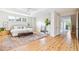 Spacious main bedroom with a plush rug, tray ceiling, and an ensuite bathroom off to the side at 2431 Settlers St, Charleston, SC 29492