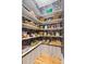 Neatly organized pantry with shelves stocked with various food items and storage baskets at 2431 Settlers St, Charleston, SC 29492