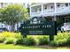 Waterfront Park signage amid lush greenery, indicating a public space at 2431 Settlers St, Charleston, SC 29492