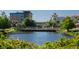 Picturesque view of a pond with buildings and greenery in the background at 2431 Settlers St, Charleston, SC 29492