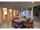 Covered porch with dining table and chairs, perfect for outdoor entertaining at 2431 Settlers St, Charleston, SC 29492